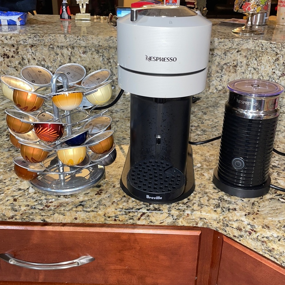 Nespresso Vertuo Next Espresso coffee bundle with frother and pod holder.